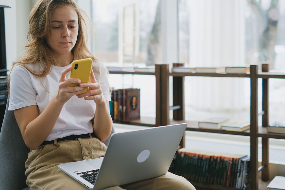 Person browsing and booking a hotel on a smartphone