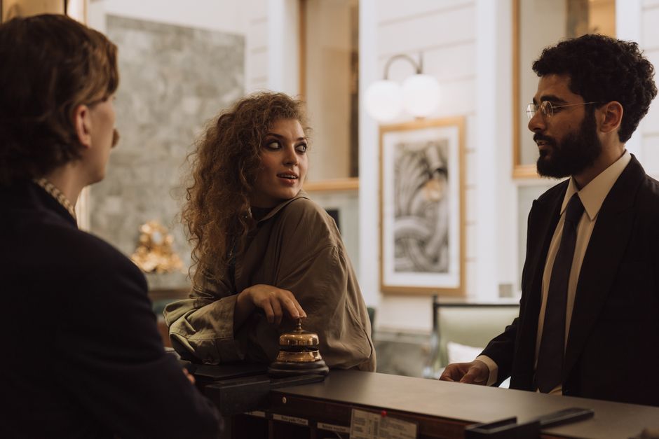 Guests being welcomed at a luxury hotel reception desk